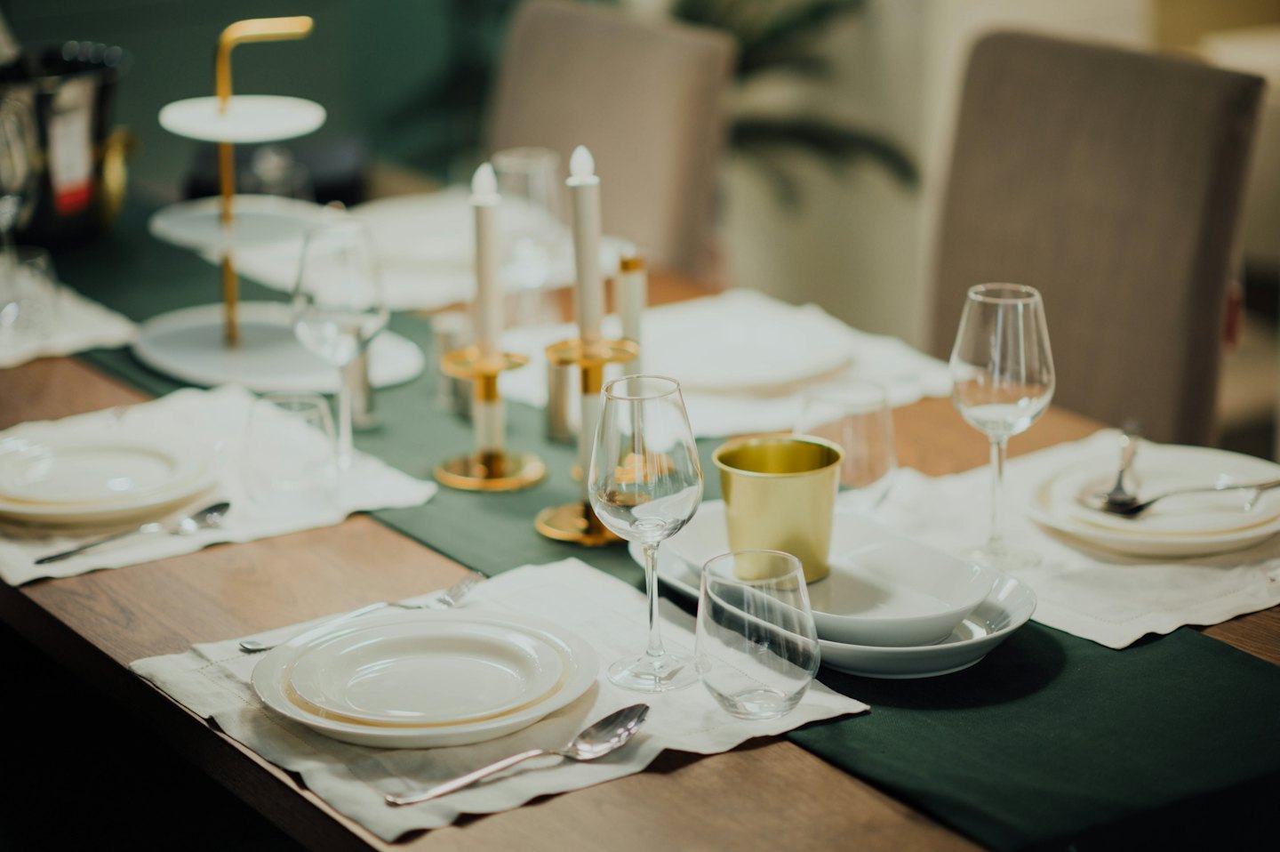 A formal dining table set for guests with elegant place settings.